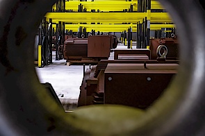 View through eyebolt on warehouse with electric motors