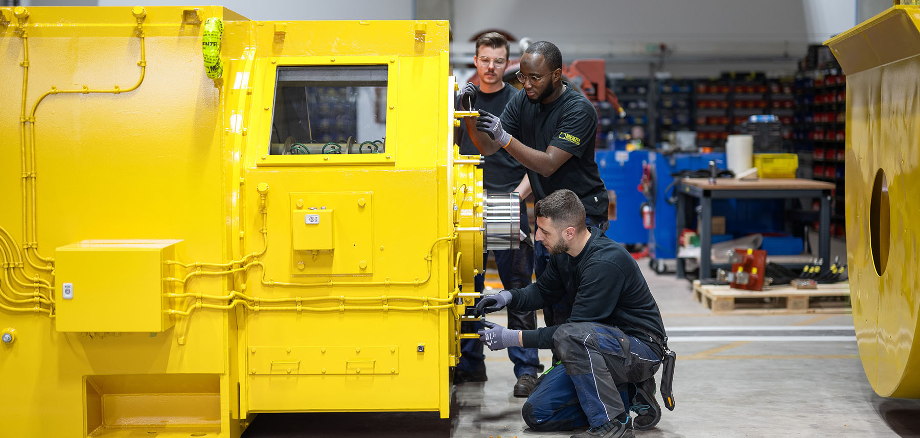 Technician assembling large electric motor Technician assembling large electric motor